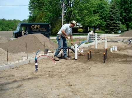 Kelly putting the sand back in place after the inspection.