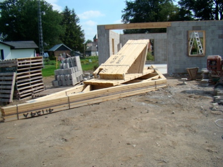 The garage roof trusses arrived as well just as we were nearing completion on the house wall. 