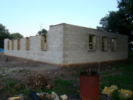 August 29, Sunday, West wall stacked, all window frames in 3 walls, East end and West end of North wall stacked to top