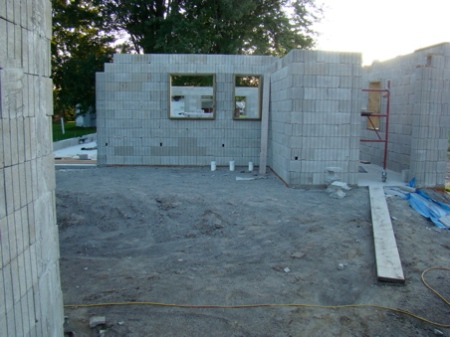 East wall complete to top except for one course on top of entry wall. Tomorrow the door frame and rebar into the wall columns.