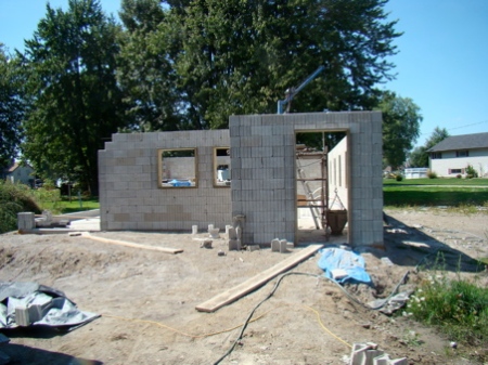 Thursday Sept 3, East wall of the house stacked, cement in columns and lintels.