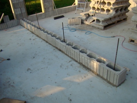 Base course of blocks and rebar for the bedroom wall.